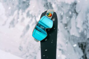 a snowboard with goggles